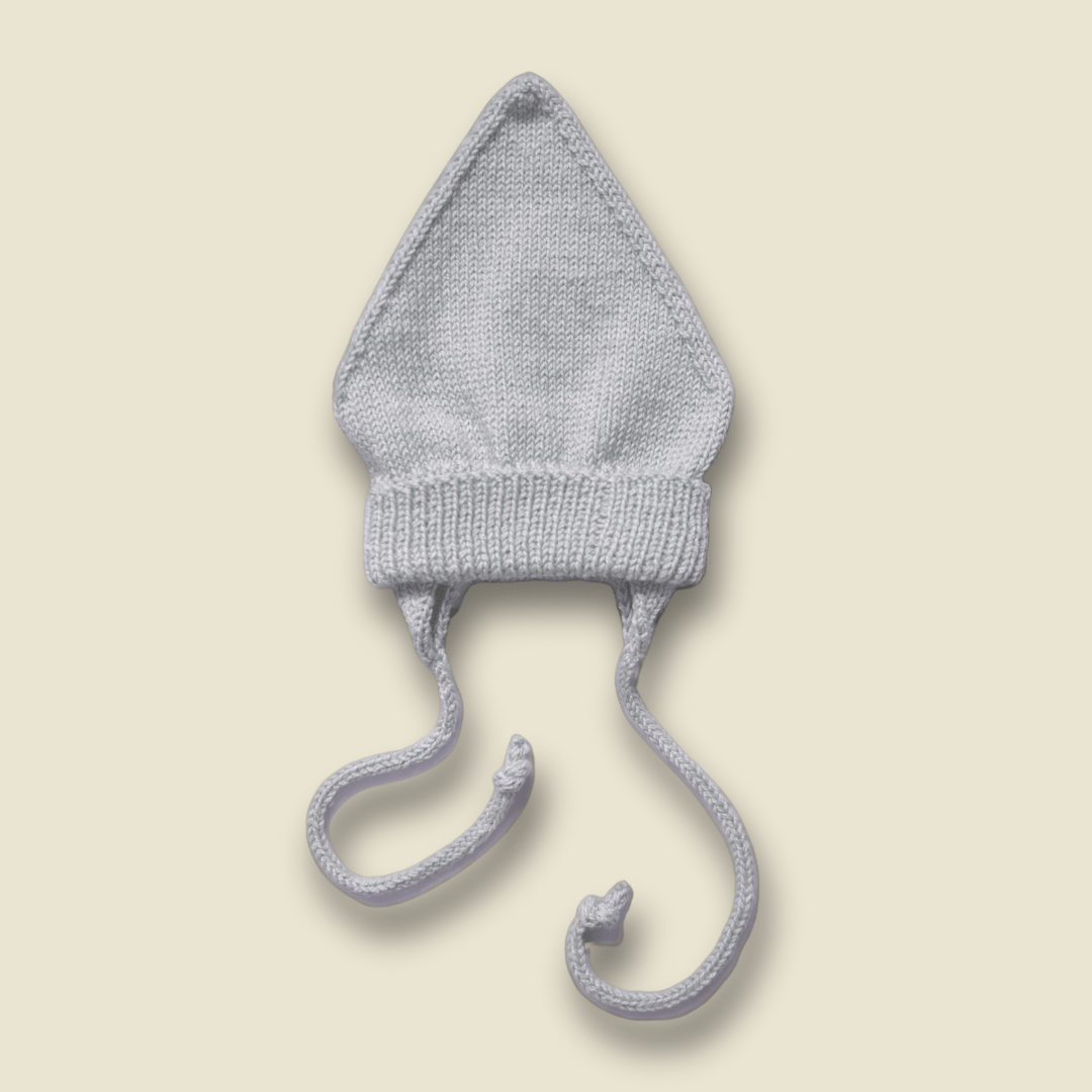 Collection of Tuque en laine de mérinos à cordons - 3-12 M - avoine - Timininous in a gallery layout